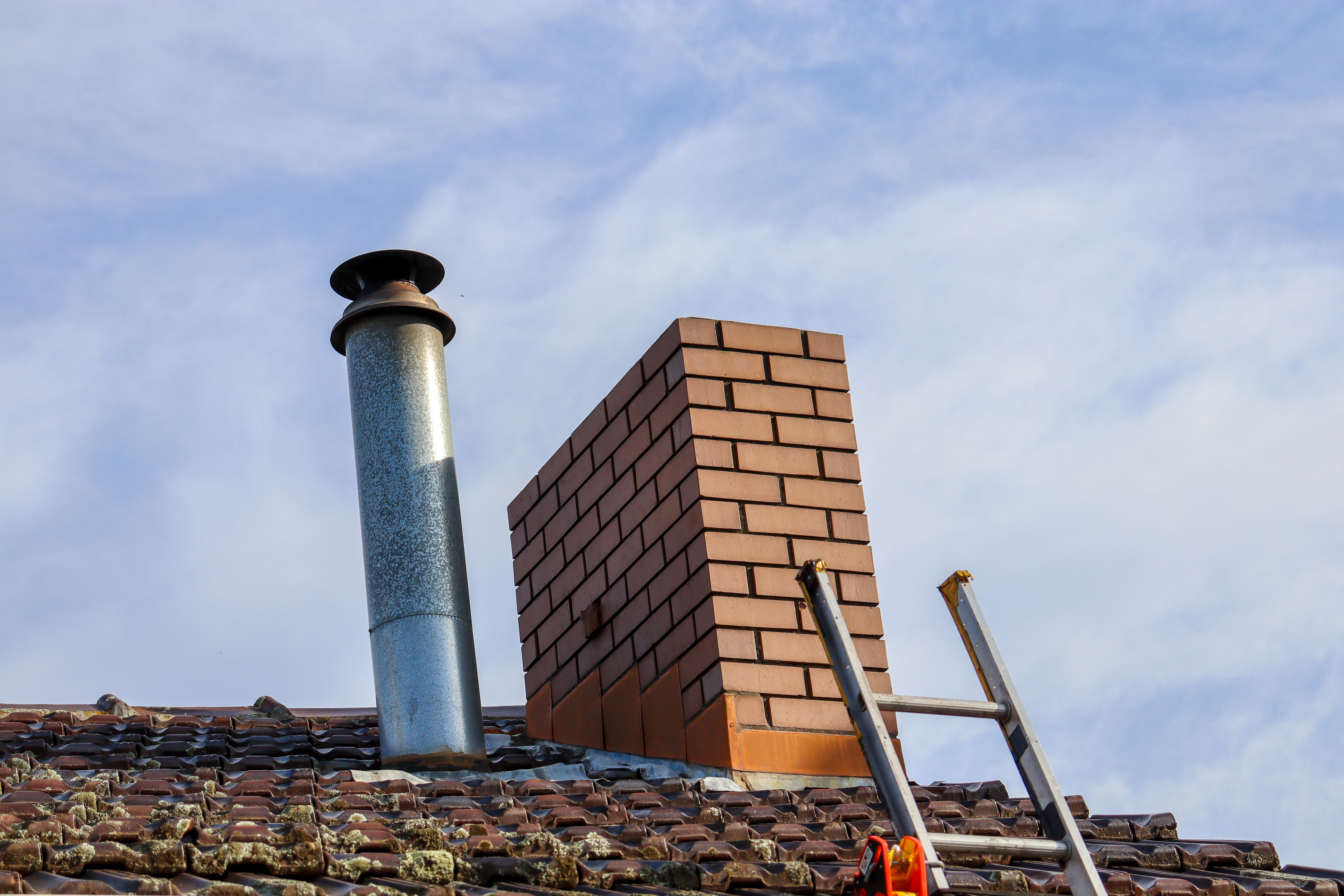 low angle view chimney ladder roof against sky